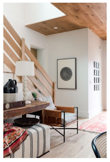 The entryway serves as the most welcoming spot in the home, with the multitude of textures lending a homely feel.