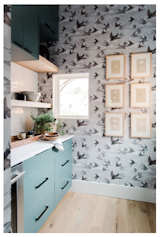 What one would assume is the refrigerator door actually opens up into a playful pantry that doesn't let its function stand in the way of a little fun.