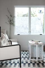 Sunny days can be spent lazing on CFC chairs. Cartwright made sure that the rug and pillows were of a similar style, in order to keep the room orderly and focused.