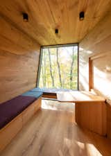 Shed & Studio and Storage Space Inside, playful pillows can be rearranged in any manner, and are often used as mock beds for relaxing and looking at the canopies above.  Shed & Studio Storage Space Photos from Snøhetta’s New Cabins in Oslo Offer Refuge For Long-Term Hospital Patients