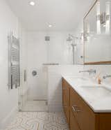 Master Bathroom utilized a bright white palette and layered in lots of  lighting with honey rift oak accents.  