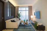 Living Room, Sofa, Table Lighting, and Ceramic Tile Floor  Photo 2 of 9 in The Diver Home by SQR Architecture + Interior Design