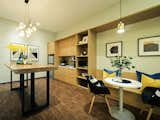 Dining Room, Shelves, Table, Stools, Chair, Bench, Bar, Desk, Vinyl Floor, Pendant Lighting, Storage, and Lamps Have a breather in the pantry.  Photo 9 of 16 in The Bustling Society : Interactive Workplace by SQR Architecture + Interior Design