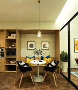 Dining Room, Pendant Lighting, Chair, Lamps, Table, Shelves, Vinyl Floor, Desk, and Storage Social Pantry - Have a break and unwind.  Photo 8 of 16 in The Bustling Society : Interactive Workplace by SQR Architecture + Interior Design
