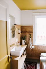 We added planking on the walls, new tile, fixtures & custom made vanity. The vintage mirror, rug & custom made brass light fixture pay homage to the bygone days. 