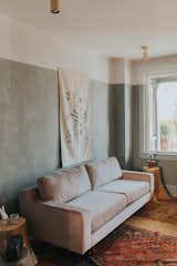 In the living room, we added fun two-toned lime wash walls! 