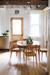Dining room with retro undertones & original floors & ceilings!