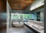 Bath Room, Ceramic Tile Floor, Vessel Sink, Glass Tile Wall, Freestanding Tub, and Ceiling Lighting  Photo 9 of 27 in A Mid-century Remodel by Robert Hintz