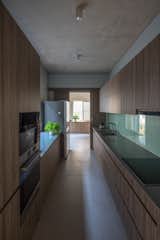 The kitchen is separated from the common living space, suitable for the needs of the family.