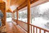 Exterior, Wood Siding Material, and House Building Type The south porch overlooks the south pond and waterfall  Photo 18 of 64 in Black River Log Home in Lake Superior Highlands by Stan Carr