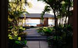 Exterior, Hipped RoofLine, Shingles Roof Material, Beach House Building Type, Glass Siding Material, House Building Type, Stone Siding Material, and Wood Siding Material  Photo 11 of 11 in Hale Hapuna by Eerkes Architects