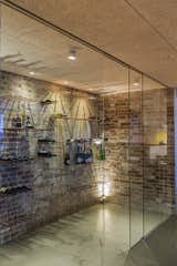 Rough, original brickwork and glass – and a collection of fine wines. Jesper designed the storage solution in the wine cellar, which can now be purchased from Erbs Design. As in the other rooms of the house, there was a clear strategy for lighting.