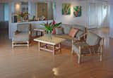 Living Room, Light Hardwood Floor, End Tables, Sofa, Track Lighting, Coffee Tables, Chair, and Pendant Lighting Hawaiian style living room  Photo 9 of 22 in The Beach House, Kaua'i Vacation Rental--The Best Ocean Front Paradise in Kaua'i by Tom Stirling
