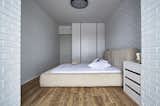 Bedroom, Night Stands, Bed, Medium Hardwood Floor, Wardrobe, Ceiling Lighting, and Dresser  Photo 18 of 25 in Stripe by Olga Kravchuta