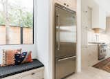 Kitchen, Wood Cabinet, Range, Marble Backsplashe, Marble Counter, and Refrigerator  Photo 17 of 34 in OKC Modern by Emily  Hart