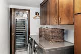 Laundry Room, Wood Cabinet, and Side-by-Side Laundry room with wine fridge  Photo 18 of 22 in Brutalist Portland Condo by Dane Kealoha