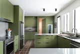 Kitchen w/ quartzite counters, Dunn Edwards "Frond" green custom cabinets. Hidden door to laundry, pantry and garage.