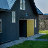 Incorporating a 12-inch-thick double stud exterior wall, the contemporary farmhouse is a prime example of green construction, down to the air-to-water heat pump boiler.