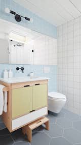 A Fireclay-tiled second bathroom with Kerf cabinets is yet another boon of the extension.