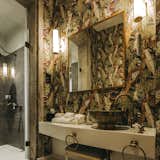 Bold, whimsical wallpaper covers the "Exotic Birds" bathroom.