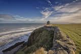 Downhill Strand in County Londonderry, Northern Ireland. Mussenden Temple is perched on cliffs above the beach.