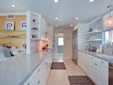 The decidedly contemporary kitchen, stocked with stainless steel appliances.   from Favorites