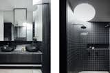 Curved nuances even extend to the shower in the sleek, black-tiled bathroom.