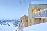 Cabins are accessed via steel bridges on the second floor, a clever way of responding to the extreme annual snowfall amounts.