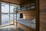 Bunk beds, cleverly built into the cedar millwork, face the lake.