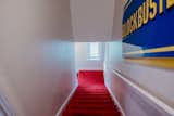 In a Netflix world, a vintage Blockbuster sign greets guests as they walk up the carpeted stairs to the Slater.