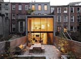 Exterior and House Building Type From the garden, an illuminated view into the bi-level extension.   Photo 1 of 32 in Houses to look at by Tom Schott from A Timeworn Brownstone in Brooklyn Becomes a Growing Family’s Sanctuary