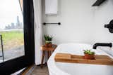 The free-standing soaking tub, found behind an 8-foot-high pocket door.