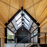 Natural light floods through the pitched roof's vast skylight.