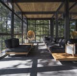Wood on the ceiling and slate on the floor carries through to the veranda, forging another layer of dialogue between the indoors and outdoors.