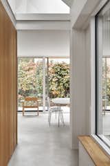 Natural light streams through the double-height, open-plan living area. 