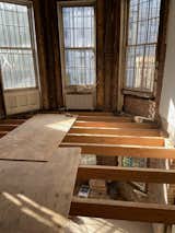 To make way for the new kitchen, the rear of the parlor was entirely gutted. Window trims were set aside and because the existing iteration was sloping and sagging, the flooring was  also replaced.