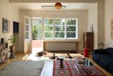 A Marset Dipping Light pendant is suspended from the living room ceiling. It complements the collection of heirloom pieces, as well as the collection of stools including Kartell’s Pilastro, the Eames-designed Model A from Vitra, and Normann Copenhagen’s Bit. Nestled underneath the window is a Hungarian-made radiator from Betatherm.