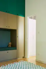 With the kitchen moved to the living area, Misha, Sarolta and her husband Lukas’s son, has a room of his own. It mingles Valchromat cabinets with an Abra rug and shelf of Sarolta’s design.