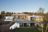 Exterior, Glass, House, Curved, Brick, Stone, Flat, Green, Metal, Concrete, Metal, and Green La Vinya, PGA Golf Resort | Studio RHE  Exterior Metal Brick Green Photos from La Vinya, PGA Golf Resort