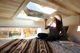 Bedroom, Recessed Lighting, Bed, and Plywood Floor The master bedroom loft features an abundance of windows including this venting roof window by Velux.  Photo 1 of 19 in Innisfree Anarres by Jennifer McCarthy