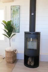 The focal point in this home is certainly the Morso wood burning stove complete with wood storage area. We love this fireplace because it is rated for mobile homes and needs very little clearance for installation. 