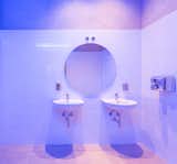 The lighting in the bathroom creates suggestive blue gradients.
