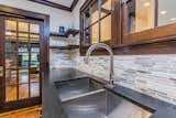 Kitchen, Ceiling Lighting, Undermount Sink, Medium Hardwood Floor, Stone Tile Backsplashe, and Granite Counter  Photo 10 of 33 in Riverside Side-ition