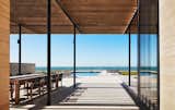 Outdoor, Pavers Patio, Porch, Deck, Swimming Pools, Tubs, Shower, Wood Fences, Wall, and Back Yard View from the Kitchen looking West towards Lake Michigan  Photo 6 of 30 in St Joseph Beachfront Home by Wheeler Kearns Architects