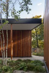 Exterior, Wood Siding Material, House Building Type, Metal Siding Material, and Flat RoofLine Black Locust Column  Photo 5 of 20 in Ravine House by Wheeler Kearns Architects