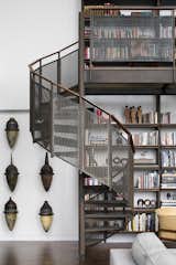 Wheeler Kearns Architects used steel to construct the shelving, storage, and stairs leading up to the mezzanine loft in the Residence for Two Collectors. The client’s father was a machinist, so the fabrication of these elements lends a personal touch to the project.