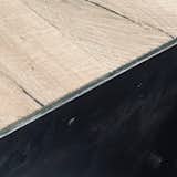 1/4" blackened steel to edge the hand scraped wood floors