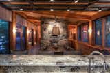 Dining Room, Slate Floor, Chair, Stools, Wood Burning Fireplace, and Table  Photo 3 of 20 in Kasshabog Lake Cottage by Sustain Design Architects Inc.