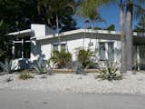 You'll love the classic lines, period consistent decor and elemental beauty in this Mid Century Modern, 3 bedroom home on Longboat Key Florida.