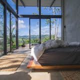 Bedroom, Lamps, Bed, Concrete Floor, and Rug Floor  Photo 4 of 7 in Platanillo Bed and Breakfast by Forsite Studio 